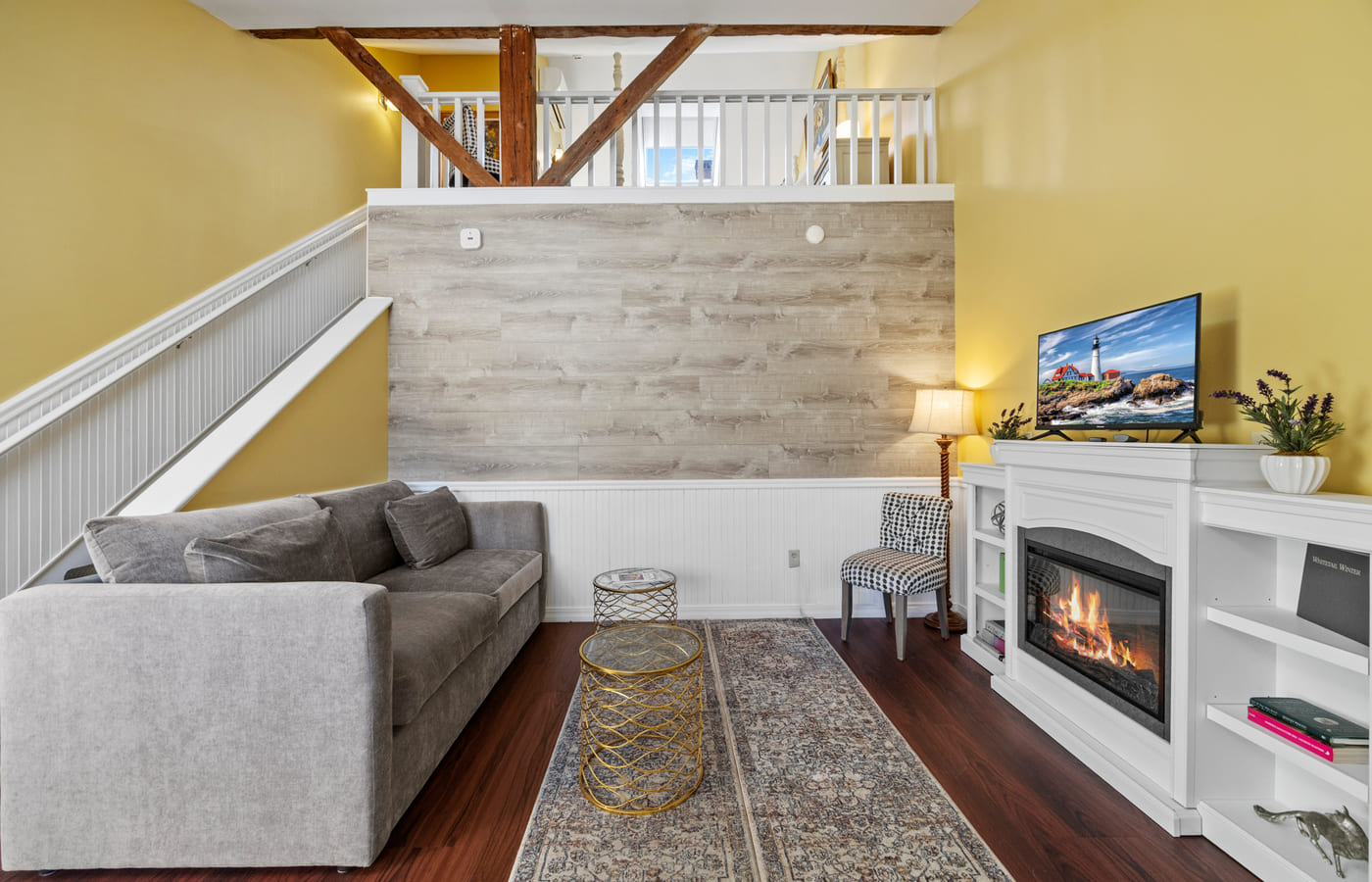 The Garden Suite’s sitting area with a lit fireplace